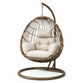 Fauteuil suspendu en rotin avec coussins beige